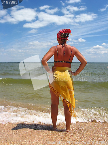 Image of girl standing at the seacoast