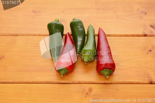 Image of Five red and green hot chilis