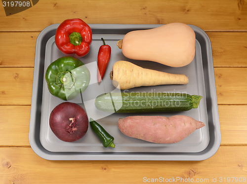 Image of Selection of vegetables on a baking tray ready for roasting