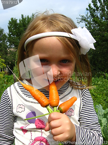 Image of Girl biting the carrot