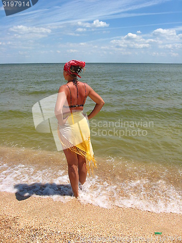 Image of girl standing at the seacoast