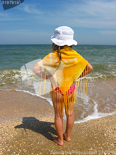 Image of girl standing at the seacoast