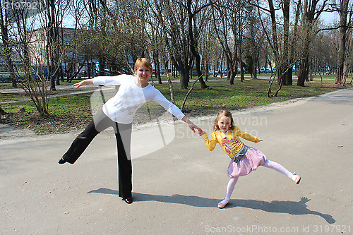 Image of Mother with the daughter which dance in the city