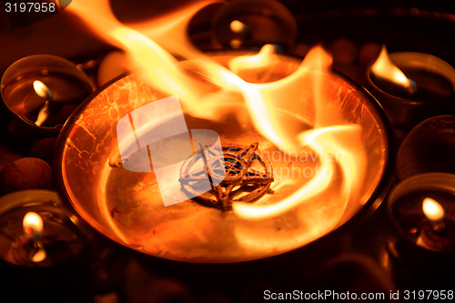 Image of Ancient pentagram burning