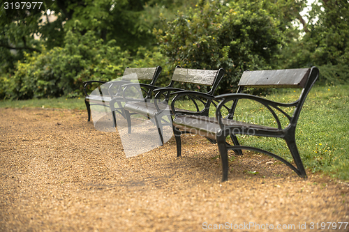 Image of Stylish bench in autumn park