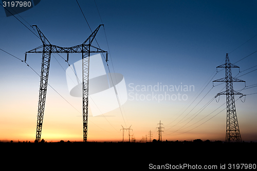 Image of Large transmission towers at blue hour 