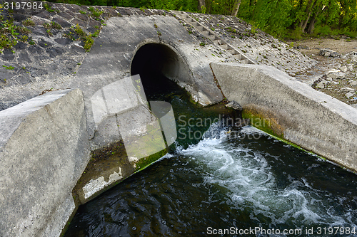 Image of Cooling water flowing into the river