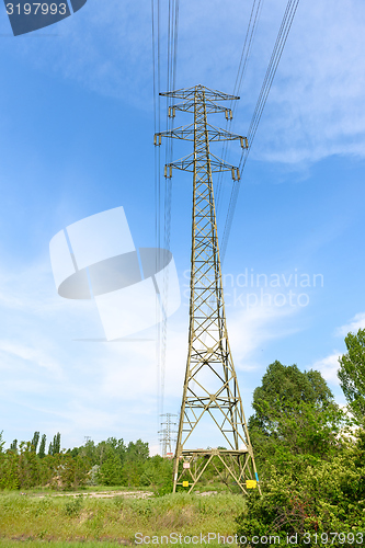 Image of Large electric pylon with blue sky