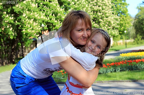 Image of mother and daughter embrace