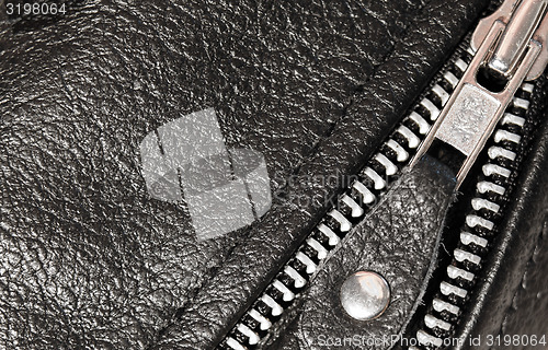 Image of Part black leather clothing with a zipper. macro