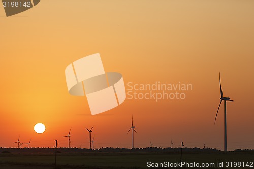 Image of Windmills silhouettes at sunrise