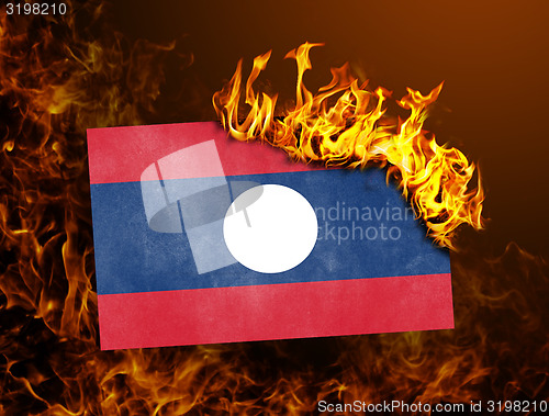 Image of Flag burning - Laos