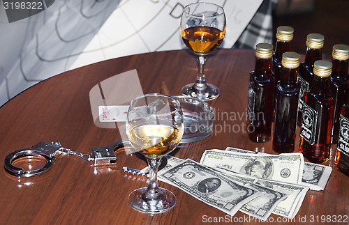 Image of money and whiskey