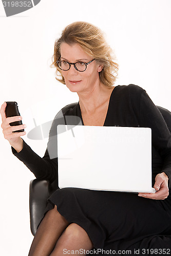 Image of senior secretary with laptop in the SMS delivery