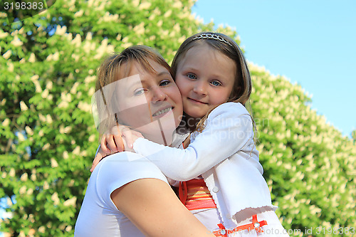 Image of mother and daughter embrace