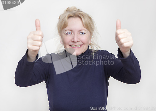 Image of elderly woman thumbs up