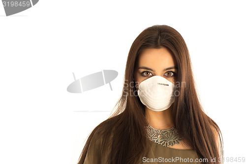 Image of Attractive woman wearing a protective mask