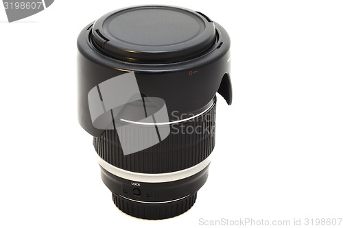 Image of the lens with the lens hood from the SLR camera on white backgro