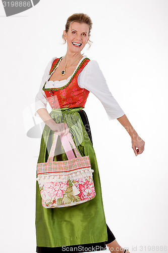 Image of Swing to the old Bavarian woman in costume