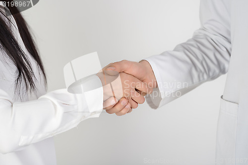 Image of Patient shaking hands with doctor 