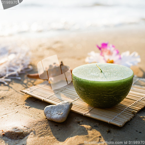 Image of One candle at the sea