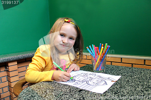 Image of girl drawing by pencils an image