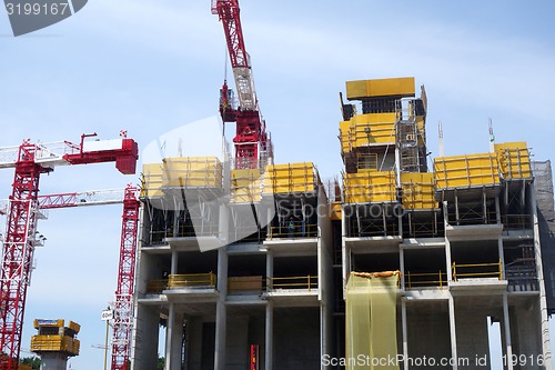 Image of Building crane and building under construction