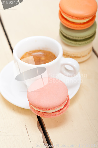 Image of colorful macaroons with espresso coffee 