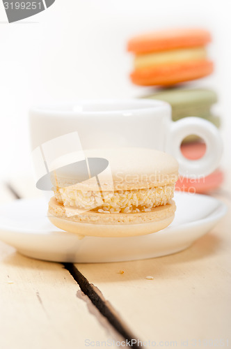 Image of colorful macaroons with espresso coffee 