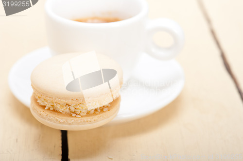 Image of colorful macaroons with espresso coffee 