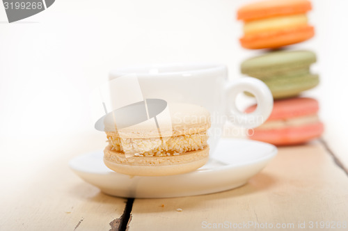 Image of colorful macaroons with espresso coffee 
