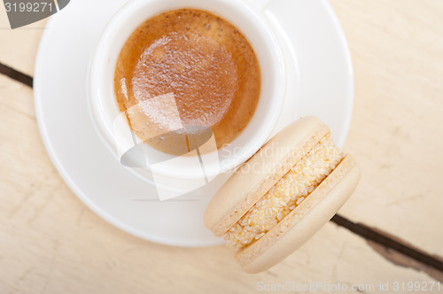 Image of colorful macaroons with espresso coffee 