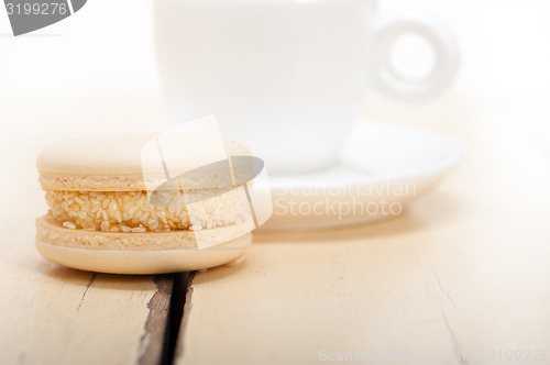 Image of colorful macaroons with espresso coffee 