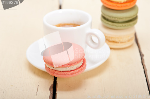 Image of colorful macaroons with espresso coffee 