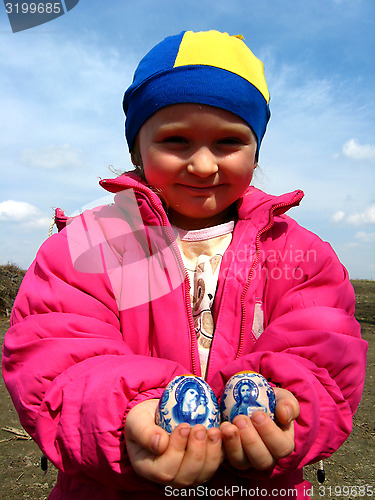 Image of Two easter eggs in the child's hands