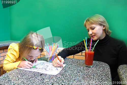 Image of image of little girl drawing at the table