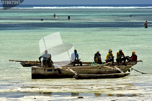 Image of beach seaweed people and boat in tanzania zanzibar
