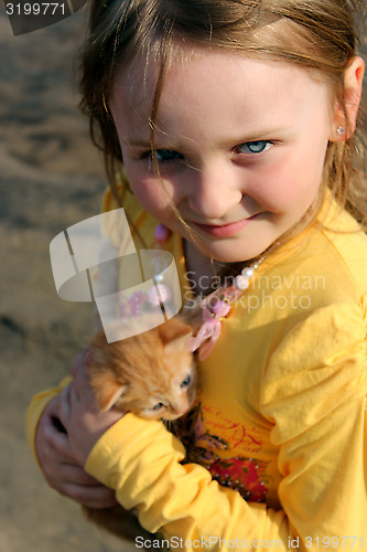 Image of girl with little red kitten
