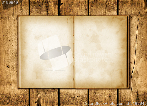Image of Note book on a wood background