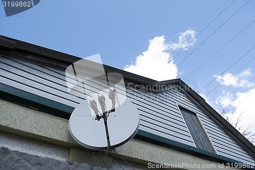 Image of satellite dish on the house