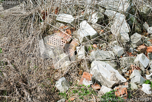 Image of construction and demolition debris near the forest