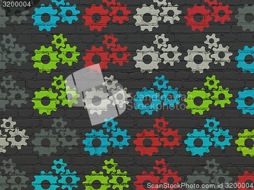 Image of Information concept: multicolor Gears icons on wall background