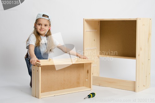 Image of child plays in the builder furniture