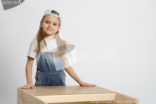 Image of Portrait of a child in working clothes carpenter