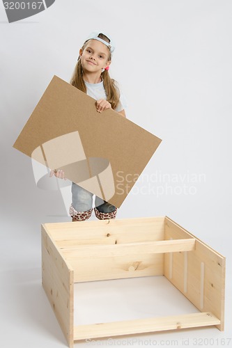 Image of Child carpenter collects dresser