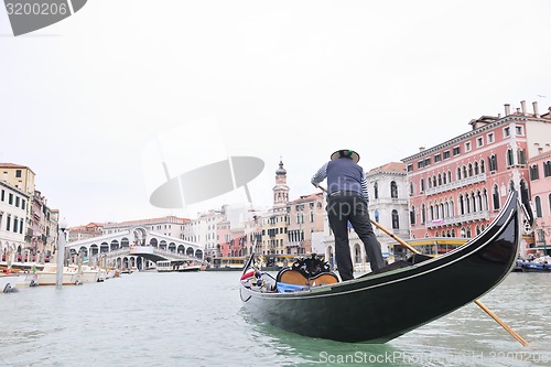 Image of venice italy, gondola driver in grand channel