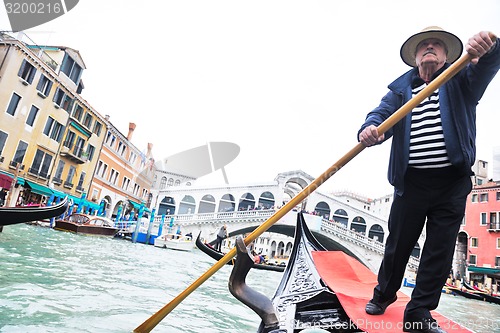 Image of venice italy, gondola driver in grand channel