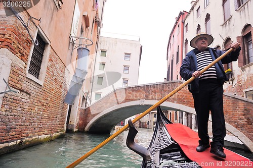Image of venice italy, gondola driver in grand channel