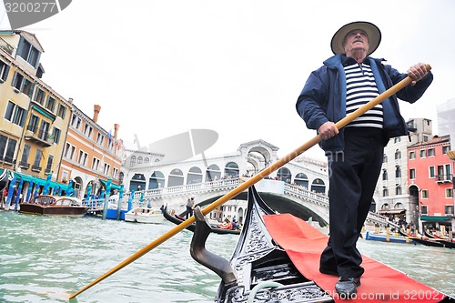 Image of venice italy, gondola driver in grand channel