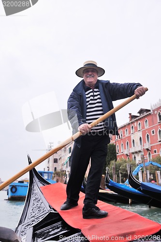 Image of venice italy, gondola driver in grand channel